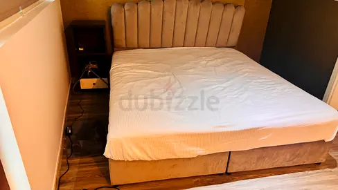 King-size upholstered bed frame with headboard, mattress, and base (beige)
