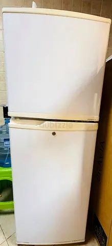 White Double-Door Refrigerator/Freezer - Compact, Good Working Condition