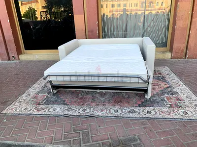 Natuzzi two seater sofa bed with mattress