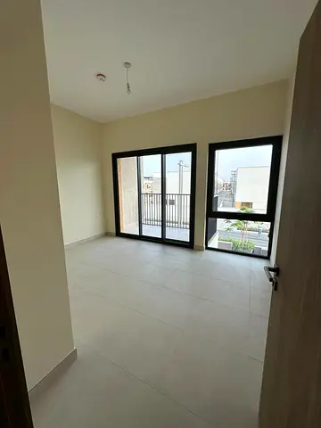 First-occupant townhouse in Al Amerah Ajman 4BR living maid 5 baths Azha community 15 min from Sharjah Airport annual rent.