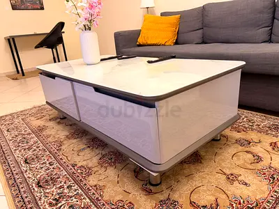 White glossy modern coffee table with storage — good condition