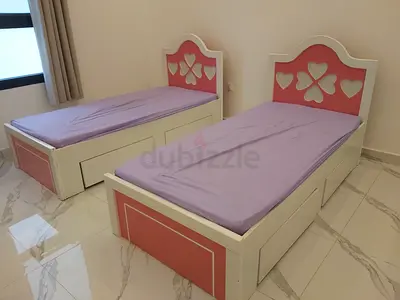 Pair of white  pink single beds with storage drawers - good condition