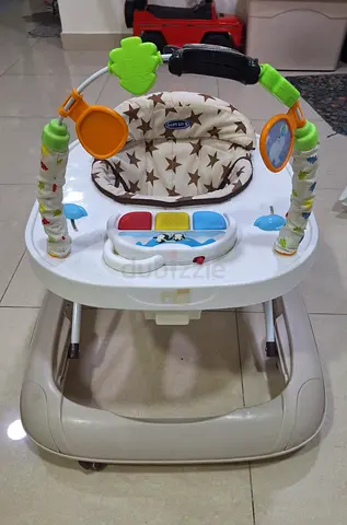Baby walker with toy bar and cushioned seat - good condition