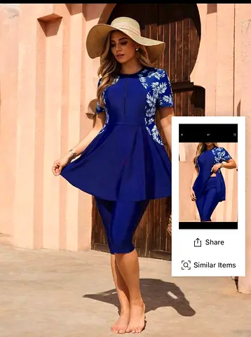 Blue modest two-piece swim dress with floral side panels (size unknown)