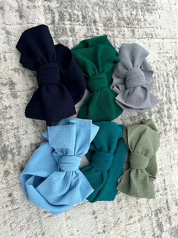 baby headbands and bows in various colours