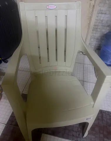 Used beige plastic armchair - sturdy outdoor/indoor seating