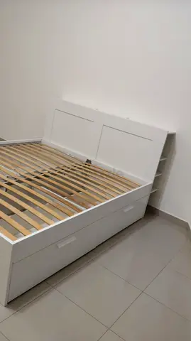 Ikea White wooden double bed frame with storage drawers and headboard shelving