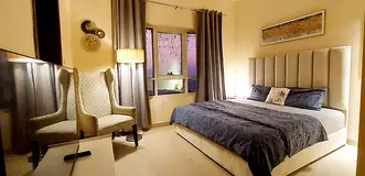 Beautifully furnished master bedroom with attached bathroom for executive bachelors / couples