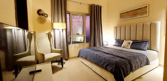 Beautifully furnished master bedroom with attached bathroom for executive bachelors / couples