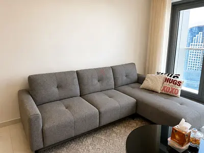 Comfortable L-shaped Grey Fabric Sofa - Good Condition