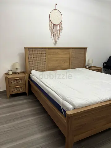 Solid Wood Bed Frame with Rattan Headboard and Matching Nightstand - Good Condition