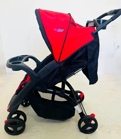 Red lightweight baby stroller with storage basket and cup holders