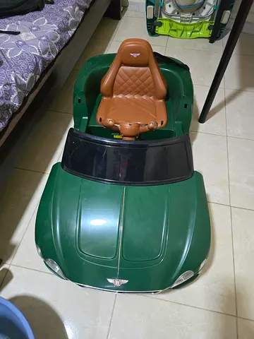 Battery-Powered Green Kids Ride-On Car with Seat and Windshield