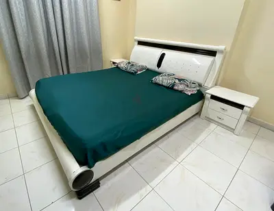 White Modern Double Bed with Two Matching Nightstands and dresser