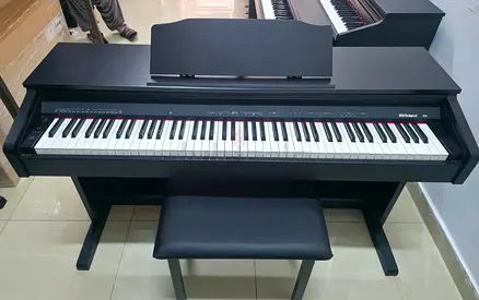 The Roland RP30 is an entry-level, 88-key digital upright piano designed for beginners, featuring