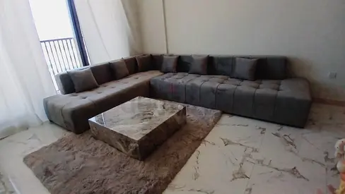 L-shaped modular grey fabric sofa set with coffee table