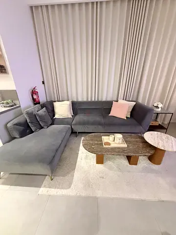 L-shaped grey velvet sofa with chaise – good condition