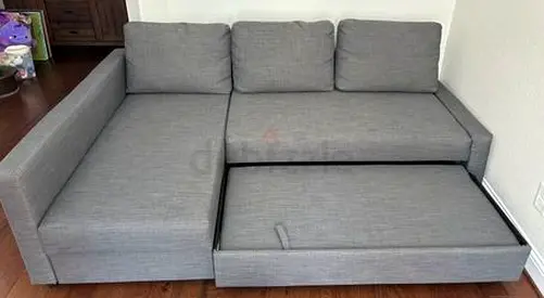 Grey L-shaped Sofa Bed with Pull-out Storage - Good Condition