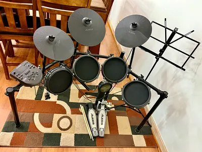 Alesis Nitro Mesh Drum Kit with sticks and music reading stand