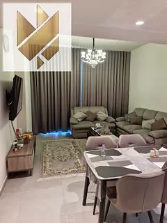 Furnished two-bedroom apartment with a living room for annual rent in Aljada, Sharjah, featuring a g