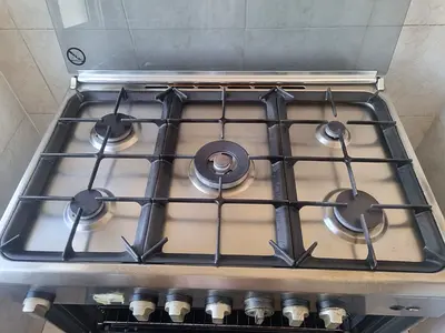 4 working-burner stainless steel gas stove with oven - used, good condition