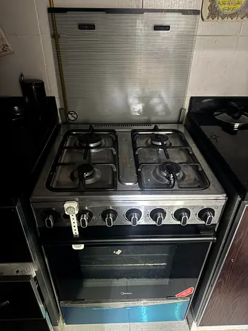 Used freestanding 4-burner gas stove with oven - stainless steel