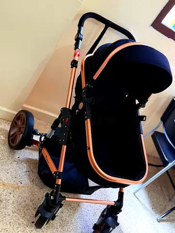 Used navy  rose gold baby stroller - good condition