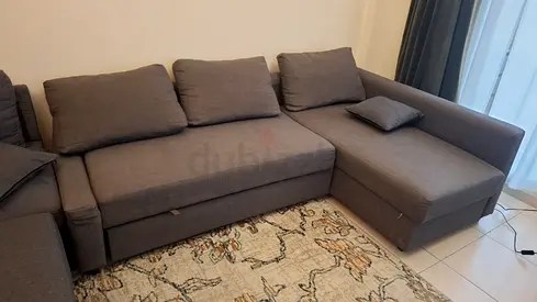 Grey L-shaped Fabric Sofa Bed with Storage — Good Condition