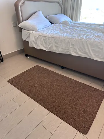 Brown rectangular bedside rug — good condition