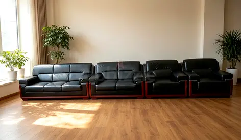 Black Leather 4-Piece Sofa Set with Wooden Base - Good Condition