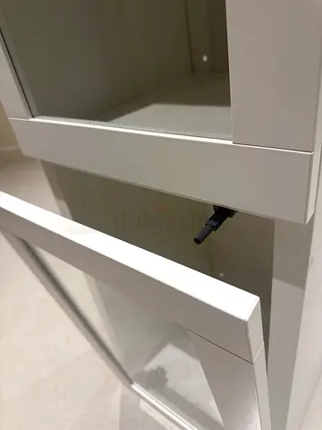 Brand new Slim white display cabinet with glass doors