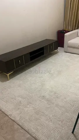 Low wooden TV unit / media console in dark finish