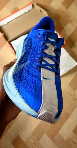 Nike ZoomX running shoes — blue, lightly used, size not specified