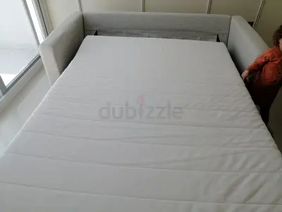 Beige 2-seater sofa — good condition