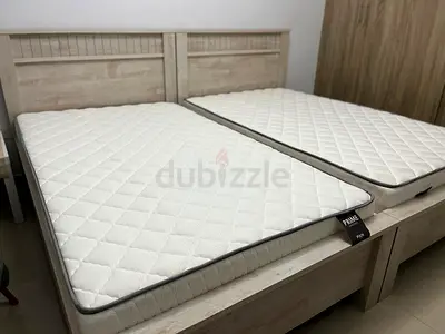 Pair of Single Beds with Two Mattresses - Light Wood, Good Condition
