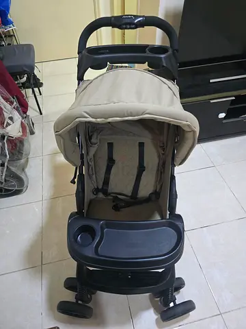 Beige Baby Stroller - Good Condition Brand Junior
