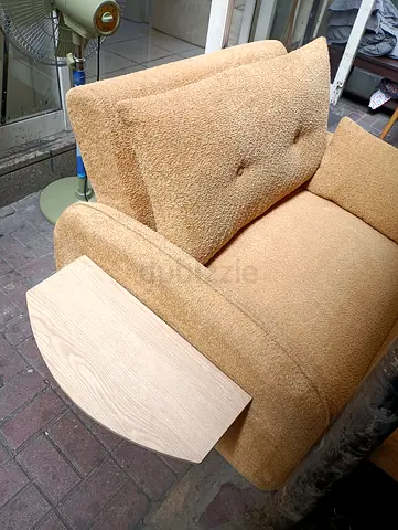 Single beige upholstered armchair with ottoman - good condition