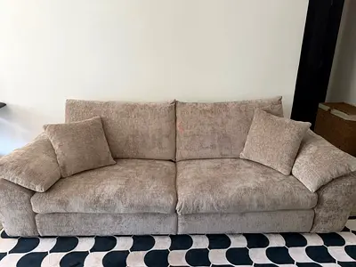 Four seater beige sofa home centre