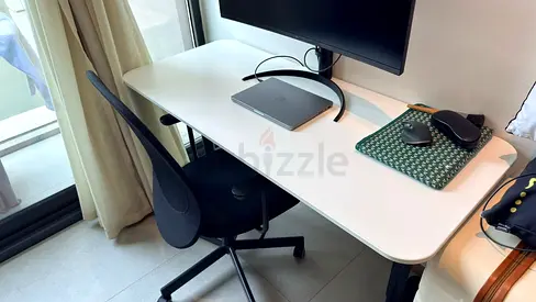 Black mesh office chair with armrests and Adjustable Table