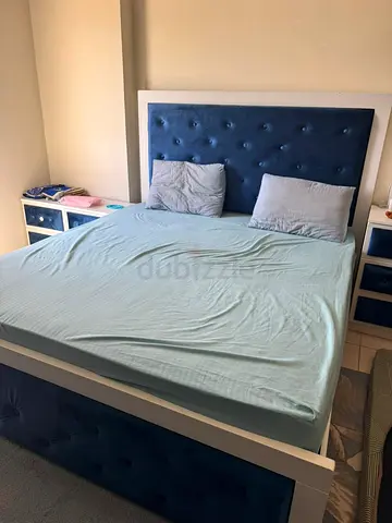 Queen bed frame with upholstered headboard and storage bedside units and dressing table