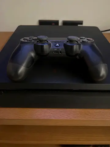 PlayStation 4 Slim with 2 DualShock Controllers - Good Working Condition