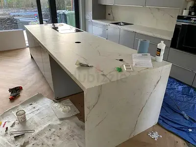 Custom Kitchen Island with Stone Look Laminate and Modern Waterfall Edges