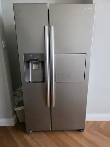 Daewoo side by side refrigerator an integrated water dispenser and mini bar counter