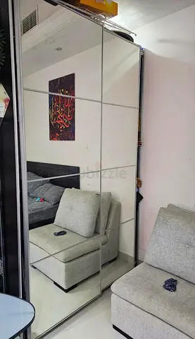 Slim black wardrobe with mirror panels - good condition