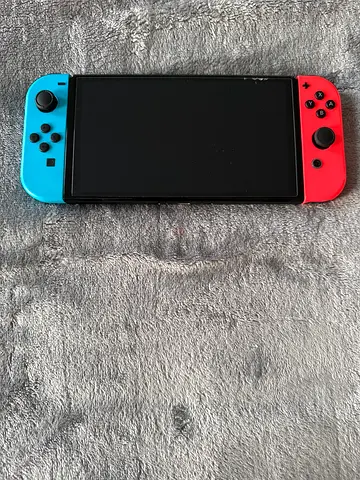 Nintendo Switch console with Neon Red/Blue Joy‑Cons - Good condition
