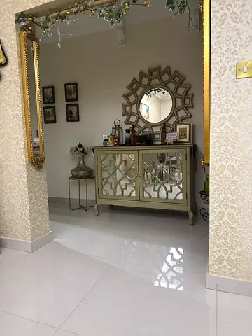 Cream mirrored console table with decorative mirror — good condition
