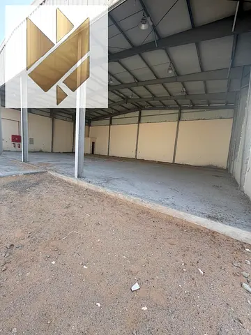 Factory for rent in Al Sajaa, first occupancy, 75 kW electricity, 10,000 sq ft.