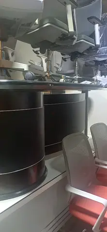 Set of modern ergonomic office chairs (used) and black round conference table base