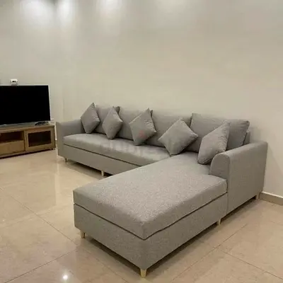 Light grey L-shaped 5-seater fabric sofa with chaise