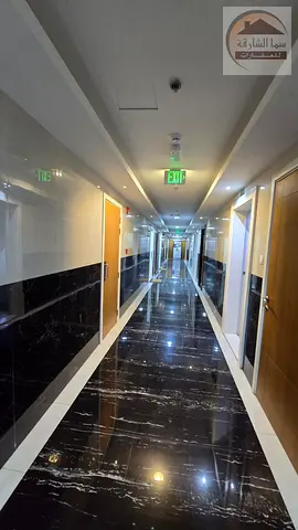 For rent in the Al-Hoshi area on Maliha Street. An apartment with two rooms, a living room, two bathrooms and a kitchen, suitable for an office for an